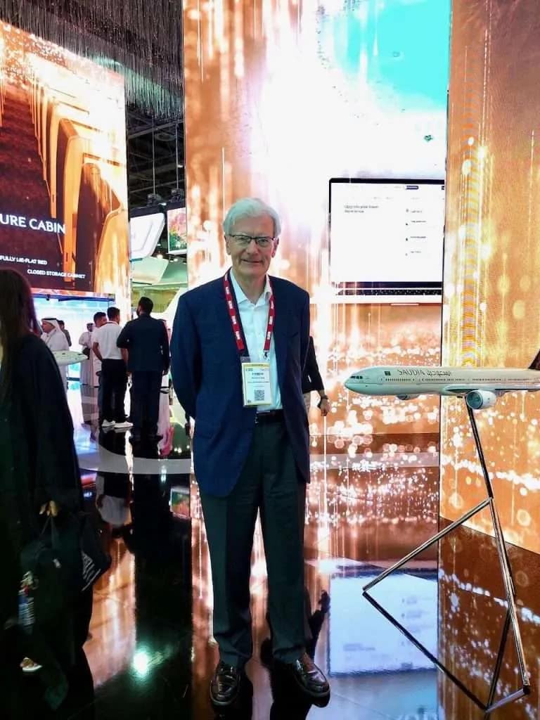 Martin hedley, smiling and standing attending Saudi Arabia travel event.